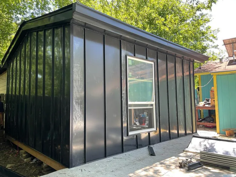 Black standing seam metal wall panels for Roof Inspection in Malibu