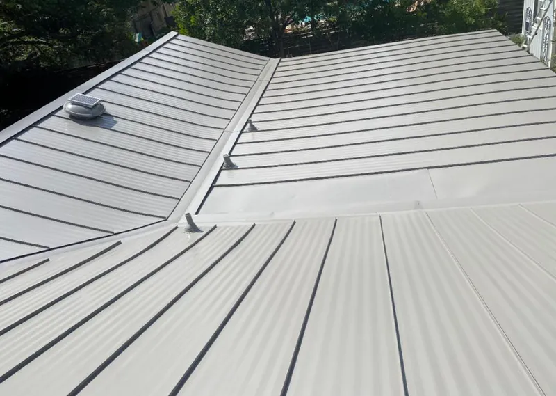 Solar attic fan installed on a metal roof for Roof Ventilation in Malibu